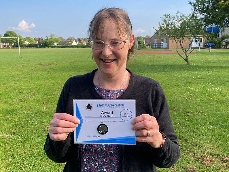 Linda with his award for the March Bray I Archery Handicap Competition Somerset